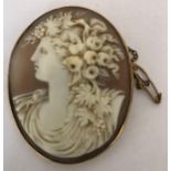 A good quality shell cameo brooch in yellow metal mount, tested as 18ct carved with a classical