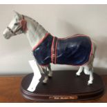 Welsh mountain pony from the John Beswick studio of Royal Doulton in a grey gloss with blue rug on
