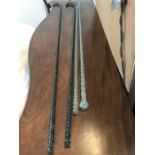 Four 19thC glass twist walking sticks from the Hull Glass company. 127cms l.