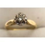 An 18 carat gold and single stone diamond ring, 3.1gms. Size M/N