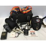 Nikon F65 camera with 28-80mm lens and carry bag, also Nikon HB26 lens, Hoya filter, larger carry