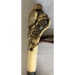 A Kendall umbrella with a carved bone handle depicting a bird label for Paragon, S.Fox and Co