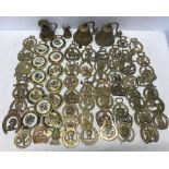 Brassware, a large collection of horse brasses, some with pottery centres, floral, hunting and
