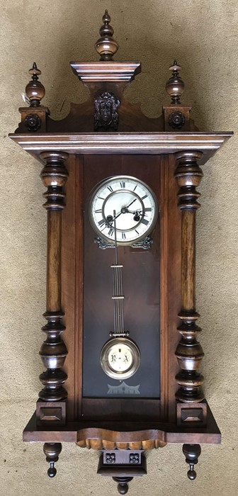 Walnut cased pendulum wall clock. DRGM movement. 100cms h x 41cms w with key. Condition