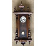 Walnut cased pendulum wall clock. DRGM movement. 100cms h x 41cms w with key. Condition