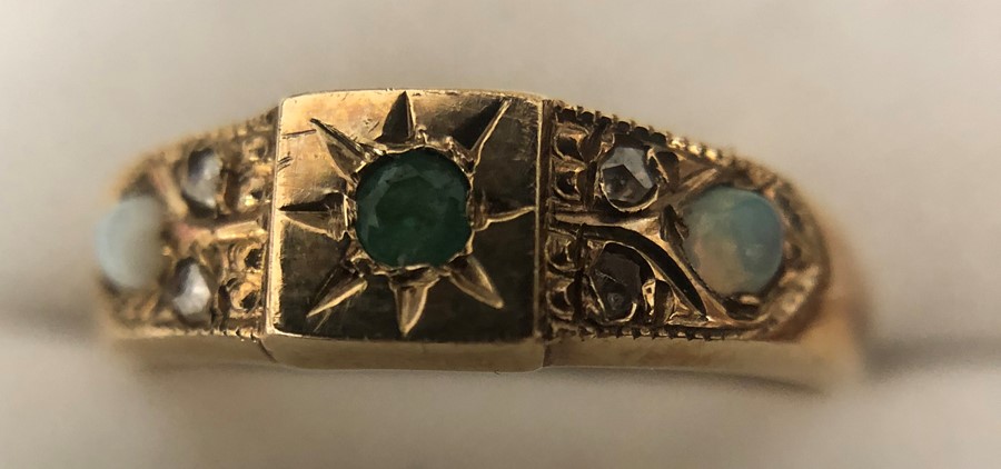 A 9 ct gold ring set with opals, diamonds and emerald. Size O. 2gms. - Image 3 of 4