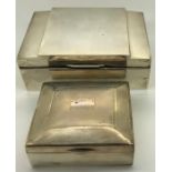 Two engine turned silver cigarette boxes, Walker and Hall 1938, 14 x 9.5cms and Birmingham 1934.