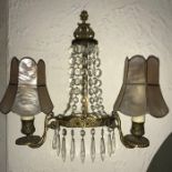 Two gilt and cut glass double drop wall lights.