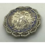 A good quality white metal and enamel compact marked .925, 6cms d.