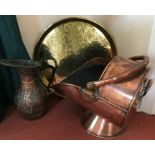 Brass circular plate, Victorian copper coal helmet and a copper jug.