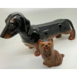 Two Beswick pottery dogs, Dachshund and terrier with two Briglin studio pottery animal money