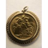 An 1889 gold sovereign in unmarked yellow metal mount. 10.2gms total weight.