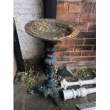 A 19thC cast iron bird bath. 75cms h.