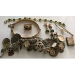 A quantity of jewellery including a silver charm bracelet, rolled gold bangle, bracelet, earrings