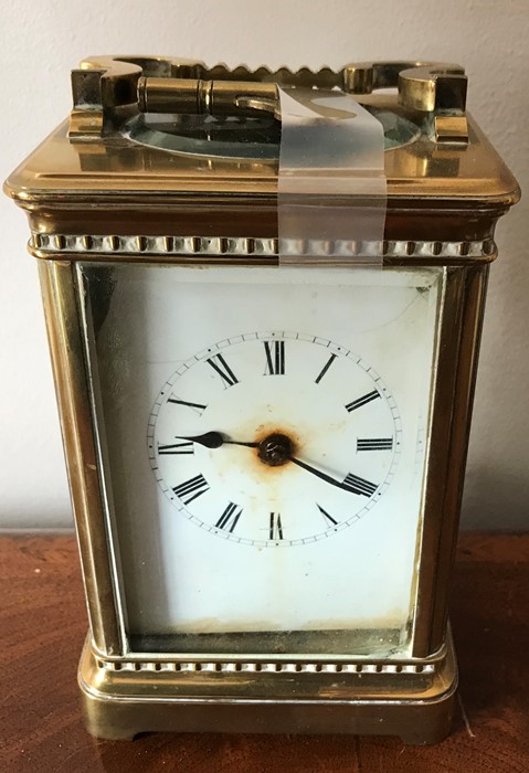 A good quality brass cased carriage clock with gorge movement. 14 h x 10cms w. Condition