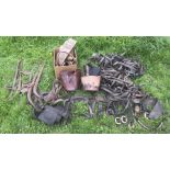 Large amount of leather cart horse harnesses, belts, leather feeding buckets, blinkers etc.