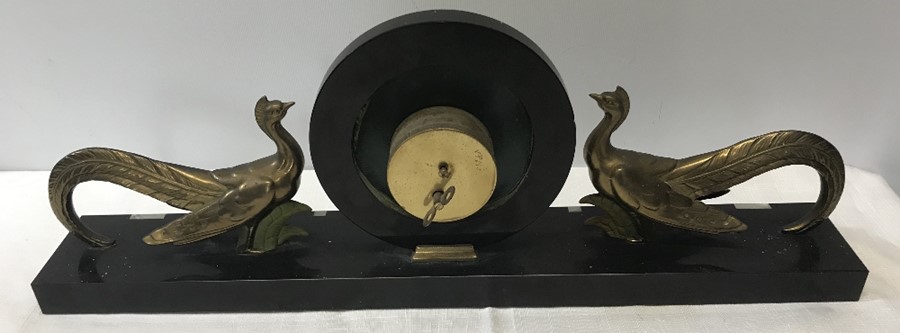 A French Art Deco mantle clock on a black marble onyx base with gilt metal confronting peacocks. - Image 3 of 3