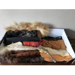 A boxed lot of vintage gloves, fur collars, skirt lifter, evening bags etc.
