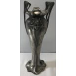 An Art Nouveau pewter vase. 23cms h. A maidens face depicted to each side. Condition