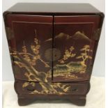 A miniature Chinese lacquer cabinet. 42 h x 31 w x 16cms d.