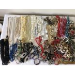 A quantity of vintage bead necklaces.
