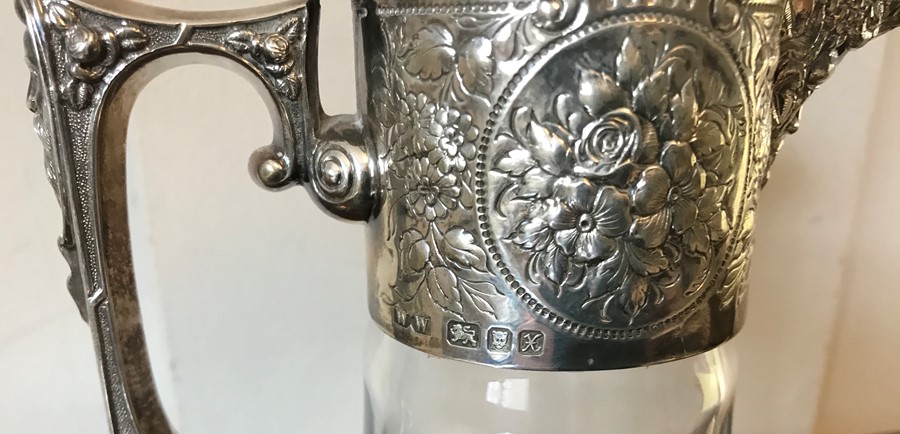 A silver topped claret jug, London 1997. Maker W.W Bacchus head pourer and floral decoration, finial - Image 2 of 3