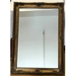 Decorative gilt framed bevel edged wall mirror, mirror size 60 x 90cms.