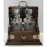 Mahogany silver plate mounted 2 bottle tantalus, mirrored back, Abbey collection hand cut crystal by