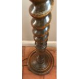 An oak barley twist standard lamp. 145cms h.