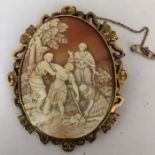 A large good quality shell cameo brooch bezel tested as 9ct, the rest plated, carved with biblical