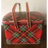 A vintage Gray Dunn tartan biscuit tin formed as a wicker basket. 27 x 16cms.