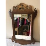 A 19thC fretted wall mirror. 65 x 40cms.