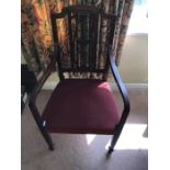 An Edwardian inlaid mahogany armchair with square tapered legs.