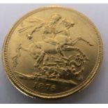 An 1876 gold sovereign.