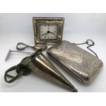 A 19thC silver plated bag with foliate scroll engraving with a baby's spoon and pusher, a silver