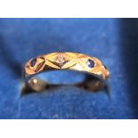 A 9ct gold ring set with blue and white stones. 2.7gms total weight. Size K.