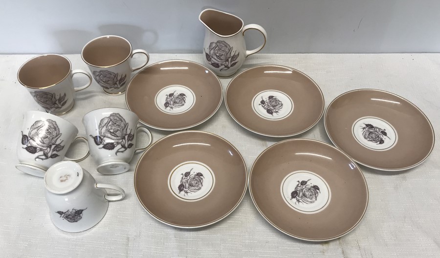 Susie Cooper part tea set, 5 cups and saucers and 1 jug. Sepia Rose pattern.