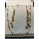 A 9ct gold chain necklace with matching earrings. 3.6gms total.