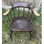 Beech and oak spindle back elbow chair. 47cms h to seat, 82cms h to back, 65cms w.