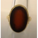 A single stone oval cabochon cut Carnelian ring stamped 14ct, yellow gold, size O, 4.23gms.