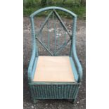 A green painted wicker armchair with box seat, height to seat 36cms, height to back 87cms x 48cms