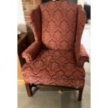 Winged armchair on square reeded legs.