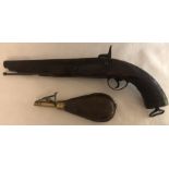 A 19thC percussion pistol with ramrod and leather and brass powder flask.