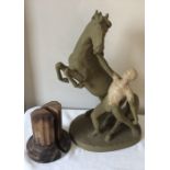 Marble column bookends and a Goldscheider model of a man and horse (painted) 42cms h.