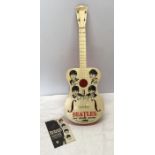 Selcol Beatles New Sound Guitar, 58cms l with a booklet. Condition ReportSurface scratches to