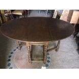 Oak oval drop leaf gateleg dining table. 101 x 140cms open leaf and 13cms h.