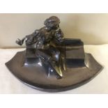 Inkwell and pen stand, lady leaning on a bench marked Kayser, marked to front Wilhelm 1915. 37 x