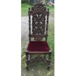 Carved oak high back hall chair, turned stretcher base, height to seat 48 h, 130 h to back, 48cms w.