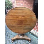A 19thC circular tip top table 92cms d. Condition ReportSplit in wood to the top, some veneer