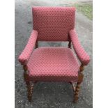 Upholstered armchair on barley twist legs and stretcher. Height to seat 52cms, height to back 100cms